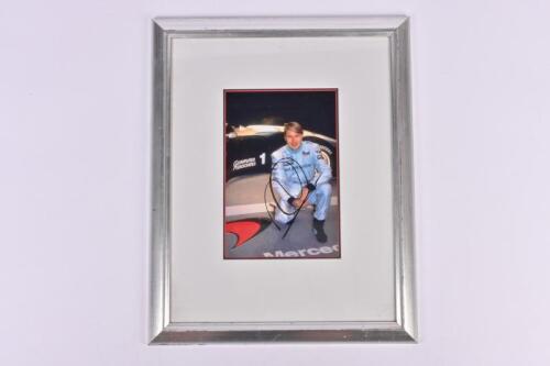 HAKKINEN: A framed picture of Mika Hakkinen. Signed by Mika Hakkinen