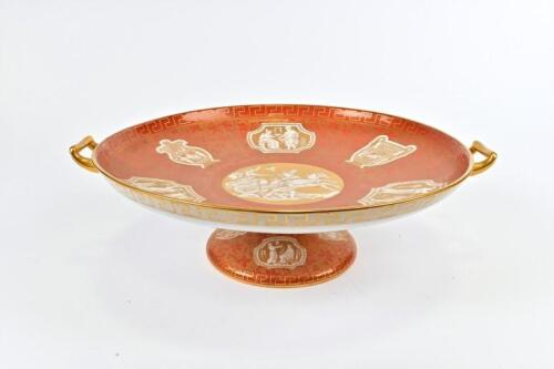 SPODE COPELAND: A Spode Copeland tazza, circa 1960 with gilt classical Greek scenes on a red ground, Greek key border and gilded handles<br>11cm high, 39.5cm across the handles