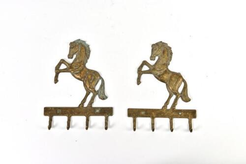 PRANCING HORSES: A pair of brass prancing horse form key hooks, 19.5cm high each