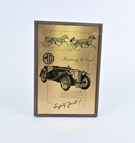 MG PLAQUE: A circa 1980s reproduction "Safety Fast" advertising plaque featuring a MG midget TC, 29 x 20.5cm