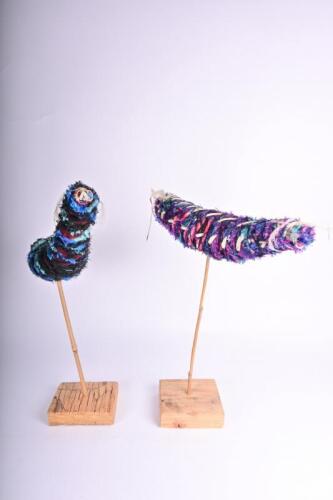 INDIGENOUS SCULPTURE: Two handwoven animals on timber bases, the largest 58cm high, 50cm wide