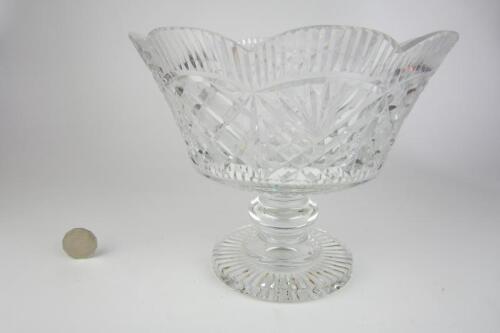 BOWL: A heavy and finely cut crystal footed bowl, 21cm high, 25cm diameter.