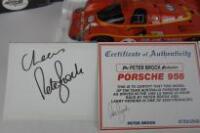 PORSCHE: A group of Porsche 956 related items (signed Brock) - 2