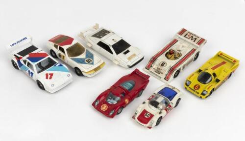 CORGI TOYS: A group of seven Corgi Toys racing cars. BMW, Ferrari, Porsche racing cars. Bond Lotus Esprit