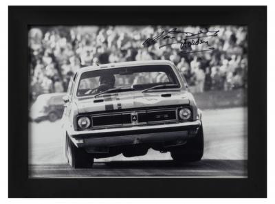 BEECHEY: A black and white picture of Norm Beechey driving a HT Holden Monaro GTS. Picture signed by Norm Beechey