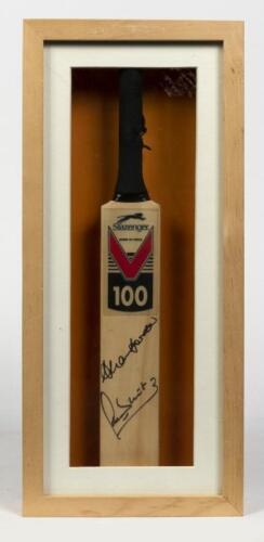 MINIATURE CRICKET BATS: A framed miniature cricket bat signed by Alan Border