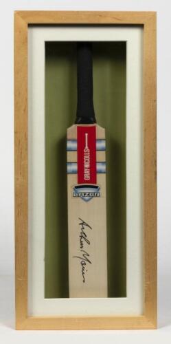ARTHUR MORRIS: A framed miniature cricket bat signed by Arthur Morris, inscribed verso: Arthur Morris, Australian Team of the Century, 41 x 18.5cm