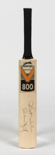 CLIVE LLOYD: A miniature cricket bat signed by Clive Lloyd
