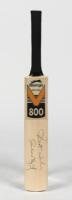 CLIVE LLOYD: A miniature cricket bat signed by Clive Lloyd
