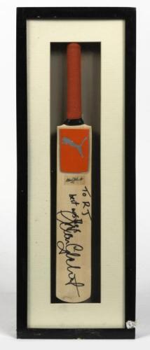 ADAM GILCHRIST: A framed miniature cricket bat signed by Adam Gilchrist, inscribed verso: Gilly