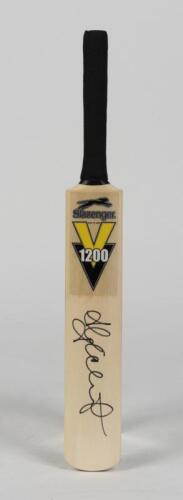 ADAM GILCHRIST: A miniature cricket bat signed by Adam Gilchrist