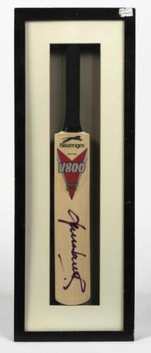 SHANE WARNE: A framed miniature cricket bat signed by Shane Warne, inscribed verso: Shane Warne, Aust Team of Century