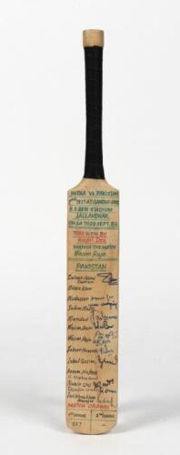 PAKISTAN & INDIA: A miniature cricket bat signed the Pakistani and Indian cricket teams from the 2nd test at Gandhi Ground, Jalandhar. 1982