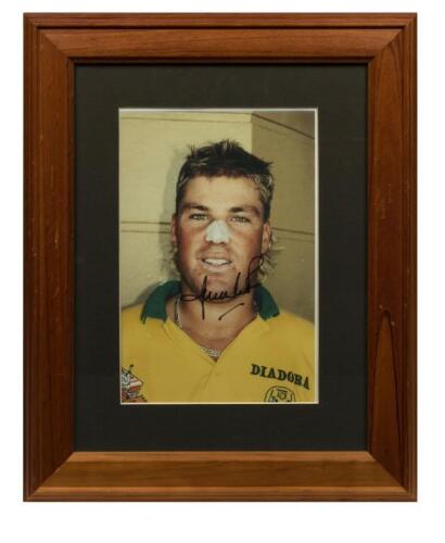 SHANE WARNE: A framed autographed photograph of a young Shane Warne