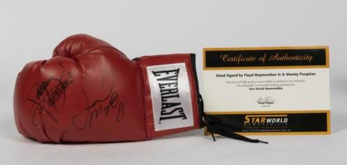 FLOYD MAYWEATHER & MANNY PACQUIAO: An Everlast boxing glove signed by Floyd Mayweather and Manny Pacquiao , with a Certificate of authenticity from Star World Memorabilia