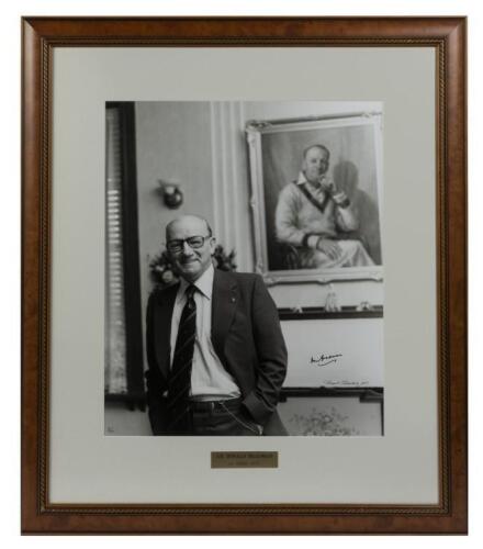 SIR DONALD BRADMAN: A large framed autographed black and white portrait photograph of Sir Donald Bradman at home in 1977, further signed and dated by the photographer David Simpson and editioned lower left 3/20, framed and glazed, image size 59 x 49.5cm, 