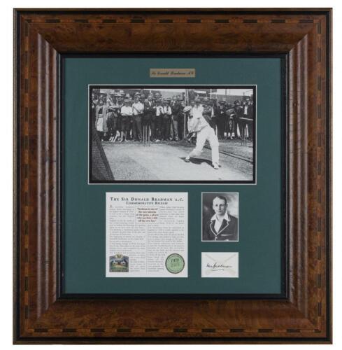 SIR DONALD BRADMAN: A framed commemorative black and white photograph of Sir Donald Bradman in the nets, released by the Bradman Museum with further inset black and white portrait photograph and signature of Sir Donald Bradman, editioned 1979/2500, the fr