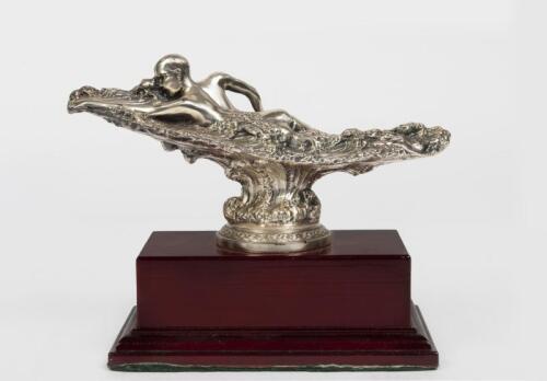 SURFING: A silver plate surfing trophy on stand, depicting a surfing paddling out , 14.5cm high