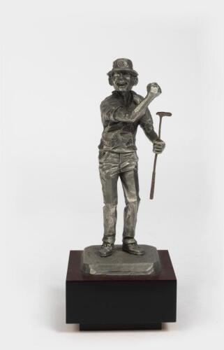 GOLF FIGURE: A pewter figure of a golfer by Philip Kraczkowski, 1972 , dated and signed to base: 1972 Philip Kraczkowski, 20cm high including wooden stand