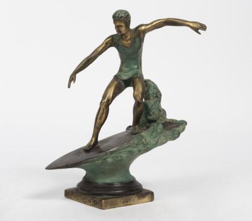 SURFING: A silver plate surfing trophy on stand, depicting a surfing paddling out , 14.5cm high