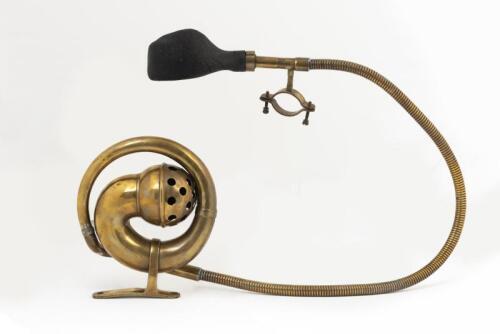 HORN: An Edwardian brass horn with reticulated hose