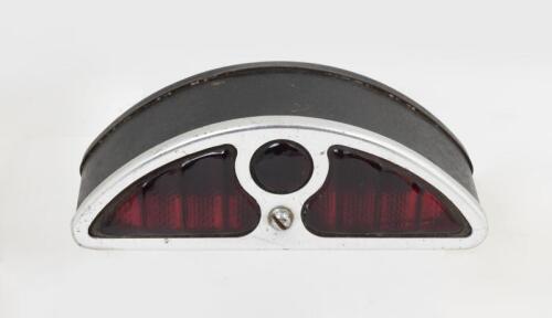 STOP LIGHT: A demi rear stop light with ruby glass with number plate lamp