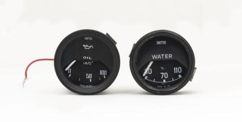 GAUGE: Two Smiths gauges for oil and water. 4.5cm diameter faces