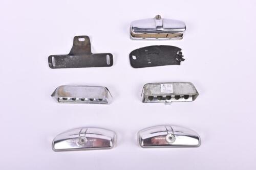 LAMPS & ASHTRAYS: A small group of number plate lamps and ashtrays. Two unused Hella number plate lenses