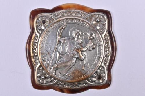 ST. CHRISTOPHER: A small French dash mounted pressed nickel on brass St. Christopher badge mounted on tortoise shell by M. Pautot