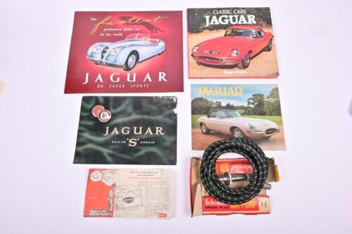 JAGUAR: A collection of Jaguar related items. Reproduction advertising tin sign depicting the 'JAGUAR XK SUPER SPORTS'