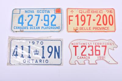 CANADIAN NUMBER PLATES: Four Canadian number plates. 'NORTHWEST TERRITORIES', 'NOVA SCOTIA', 'ONTARIO', 'QUEBEC' plates