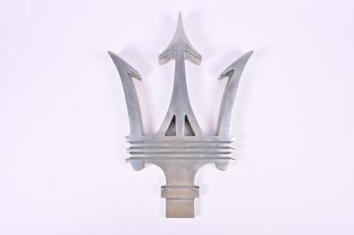 MASERATI: A large aluminum Trident Maserati logo of showroom proportions. Measures 54cm H x 38.5cm W x 6cm D
