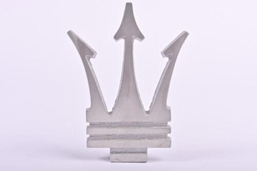 MASERATI: An aluminium Maserati trident emblem; measures 12.5 cm H, 9.5 cm W.