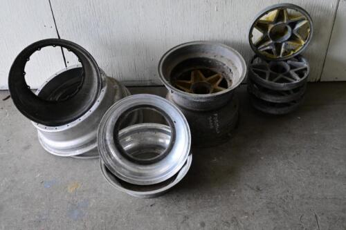 RACING WHEELS: A collection of racing wheels, some dismantled