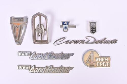 TOYOTA: Eight Toyota car badges. 'TOYOTA Land Cruiser' and 'Crown Deluxe' badges