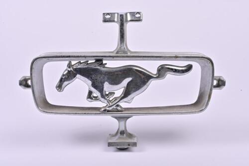 MUSTANG: A Ford Mustang grill emblem by Scott Drake for Ford