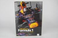 FORMULA 1: 'The Official Season Review 2013' hardcover book signed by multiple F1 drivers including Bottas, Hamilton, Webber.