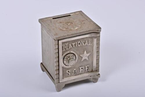 MONEY BOX: A 1920s American nickel plated cast iron and steel National Safe, 12cm high