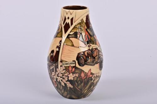 MOORCROFT/ASTON MARTIN: A limited edition (44/150) Moorcroft porcelain 'Aston Hill Climb' vase, depicting the hill ascent in 1914 at Aston Clinton, designed by Paul Hilditch in 2013, signed, in fitted presentation box, 24cm high