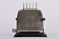 TOASTER: A circa 1950s electrictric toaster and toast rack, no cord, 21cm high, 21cm wide, 13cm deep
