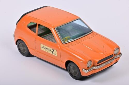 HONDA: A vintage Japanese Nomura Honda Z tin plate toy car. Circa 1970's