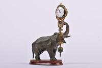 CLOCK: A German bronzed spelter elephant form 8-day mystery swinger clock by Junghans, 28cm high (working)