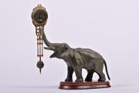 CLOCK: A German bronzed spelter elephant form 8-day mystery swinger clock by Junghans, 28cm high (working) - 2