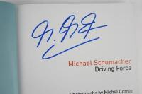 SCHUMACHER: A Michael Schumacher signed copy of 'Schumacher -The Official Inside Story of the Formula One Icon'. - 2