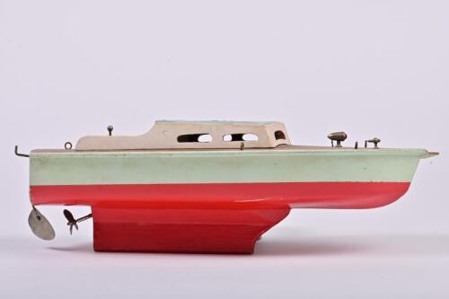 POND YACHT: A mid-century battery powered pond yacht, batteries power the motor and the forward light, missing bowsprit and possibly a mast, not know to be functional, 36cm long