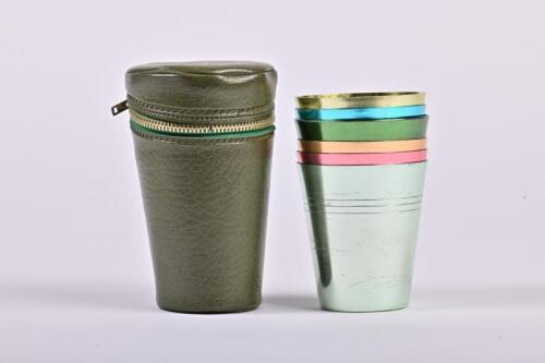 TRAVEL CUPS: A circa 1970s set of 6 anodised aluminium cups in zip-up leatherette case, the cups 8cm high