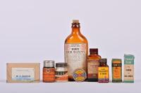 MEDICINAL: A collection of vintage medicine bottle, boxes and jars, the largest 19cm high