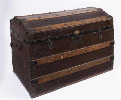 STEAMER TRUNK: An early 20th century oak and iron bound steamer trunk, 54cm high, 77cm wide, 47cm deep