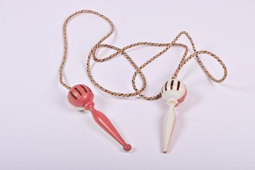 SKIPPING ROPE: A vintage child skipping rope, with bell in the handles