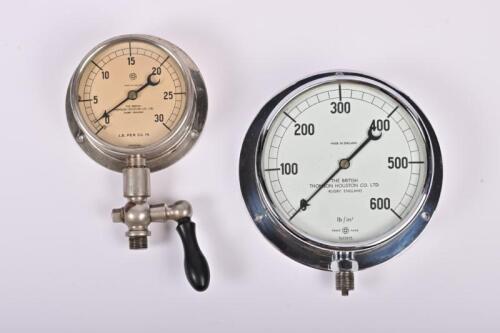 GAUGES: Two postwar wall mounted pressure gauges by 'The British Thomson Houston Co Ltd.', one with hand tap, 15cm and 10.5cm across the face